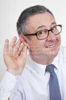 Man holding his ear to hear better