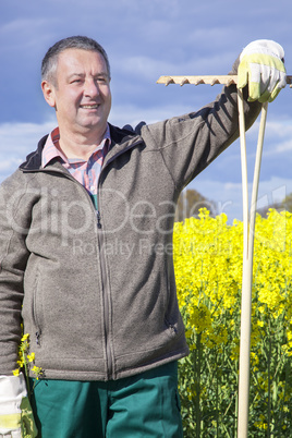 Farmer with hand tools in the field