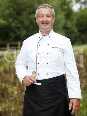 Cook in workwear in nature