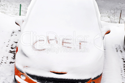 Snow letters written on car