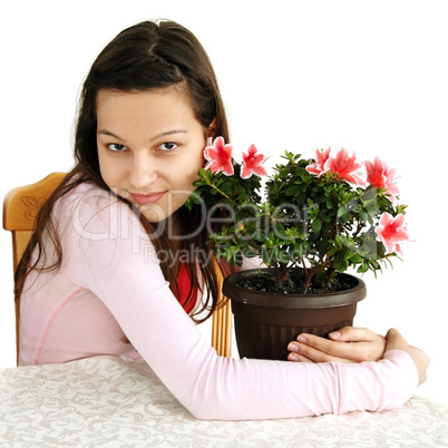 Teenage girl hugging her pot plant