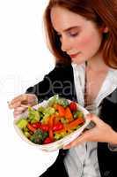 Woman eating salad.