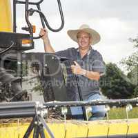 Farmer with combine harvester