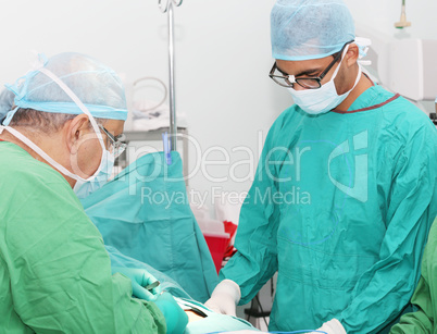 Surgeons working in operation room