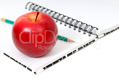Notebook and apple