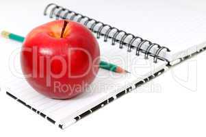 Notebook and apple