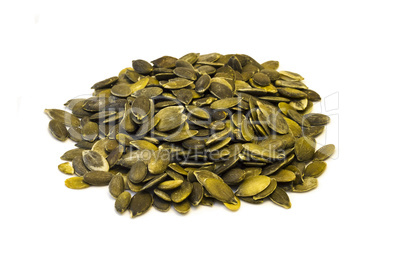 Pumpkin seeds on a white background .