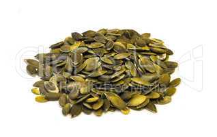 Pumpkin seeds on a white background .