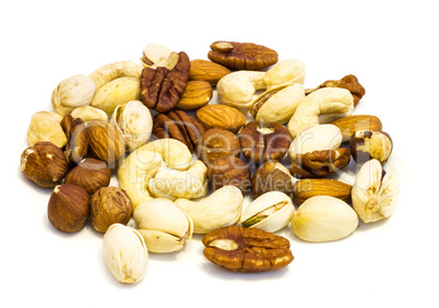 Heap of assorted nuts .