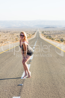 Beautiful young woman  on a road .