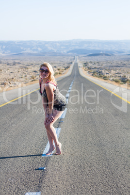 Beautiful young woman  on a road .