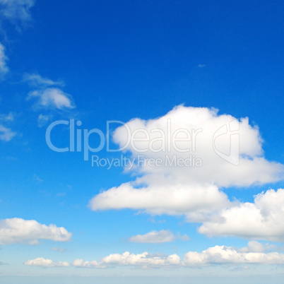 fluffy clouds in the blue sky