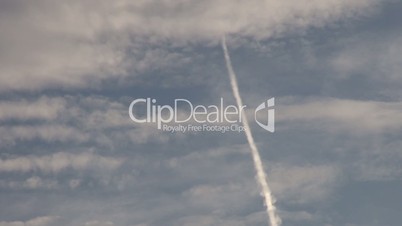 Timelapse a trace of an aircraft moves through the sky