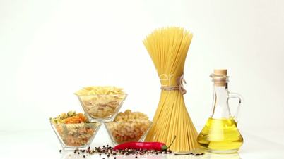 Italian pasta, Italian pasta ingredients, flour, pasta assortment of olive oil in a bottle, still life, spices spaghetti, studio shooting