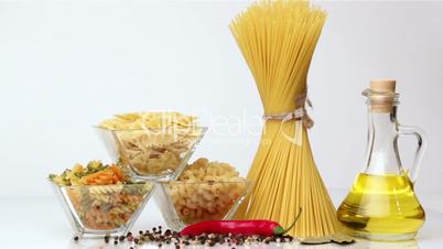 Italian pasta, Italian pasta ingredients, flour, pasta assortment of olive oil in a bottle, still life, spices spaghetti, studio