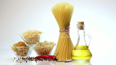 Italian pasta, Italian pasta ingredients, flour, pasta assortment of olive oil in a bottle, still life, spices spaghetti, studio