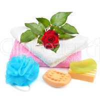 Towels, soap and sponges isolated on white background