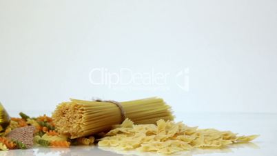 Italian pasta, Italian pasta ingredients, flour, pasta assortment of olive oil in a bottle, still life, spices spaghetti, studio