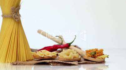 Italian pasta, Italian pasta ingredients, flour, pasta assortment of olive oil in a bottle, still life, spices spaghetti, studio