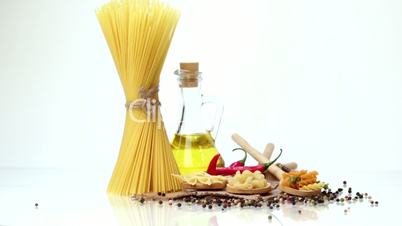 Italian pasta, Italian pasta ingredients, flour, pasta assortment of olive oil in a bottle, still life, spices spaghetti, studio