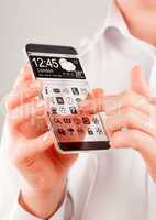 Smartphone with transparent screen in human hands.