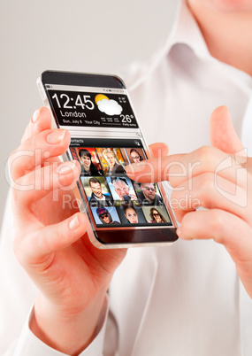 Smartphone with transparent screen in human hands.