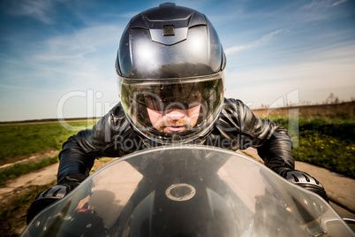 Biker racing on the road