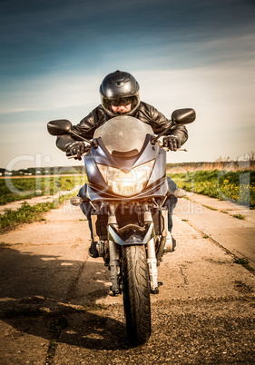 Biker racing on the road