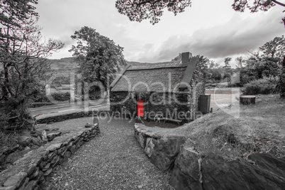 Mysterious stone home with red door
