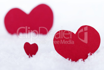 Three Red Hearts in the Snow