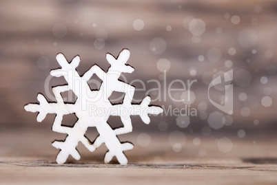 Snowflake on Wood with Bokeh