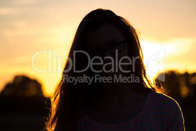 Silhouette of teenager girl  with glasses