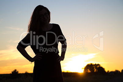 Silhouette of teenager in sunset light