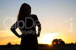 Silhouette of teenager in sunset light