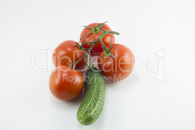 Red cherry tomatoes and green cucumbers