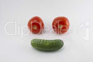 Tomatoes and cucumber, resembling the face