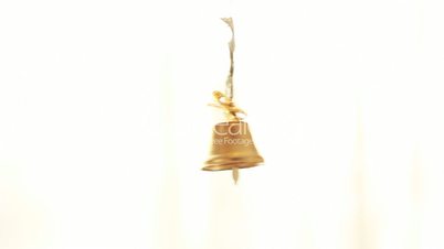 small golden bell on white background