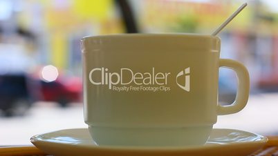 Coffee cup with street background