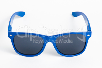 Blue plastic sunglasses isolated on white