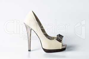 Woman beige shoes on white