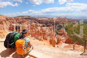 Hikers in Bryce Canyon resting enjoying view