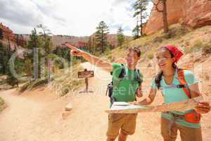 People hiking looking at hike map in Bryce Canyon