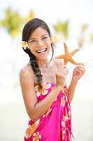 Summer vacation woman smiling happy with starfish