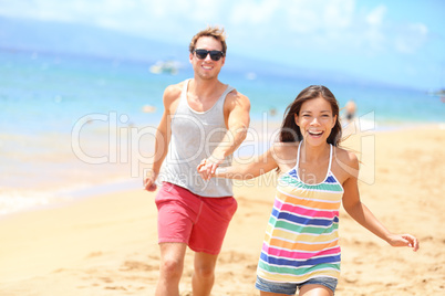 Beach couple having fun romantic vacation holiday