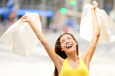 Happy shopping woman in excited winning