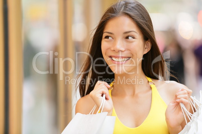Shopping woman looking at shop window display