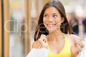 Shopping woman looking at shop window display