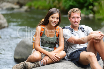 People hiking - resting hikers portrait at river