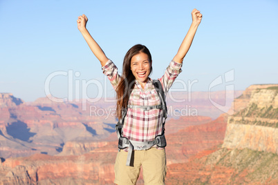 Happy winner hiker woman in Grand Canyon cheering