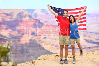 USA travel tourist couple holding american flag